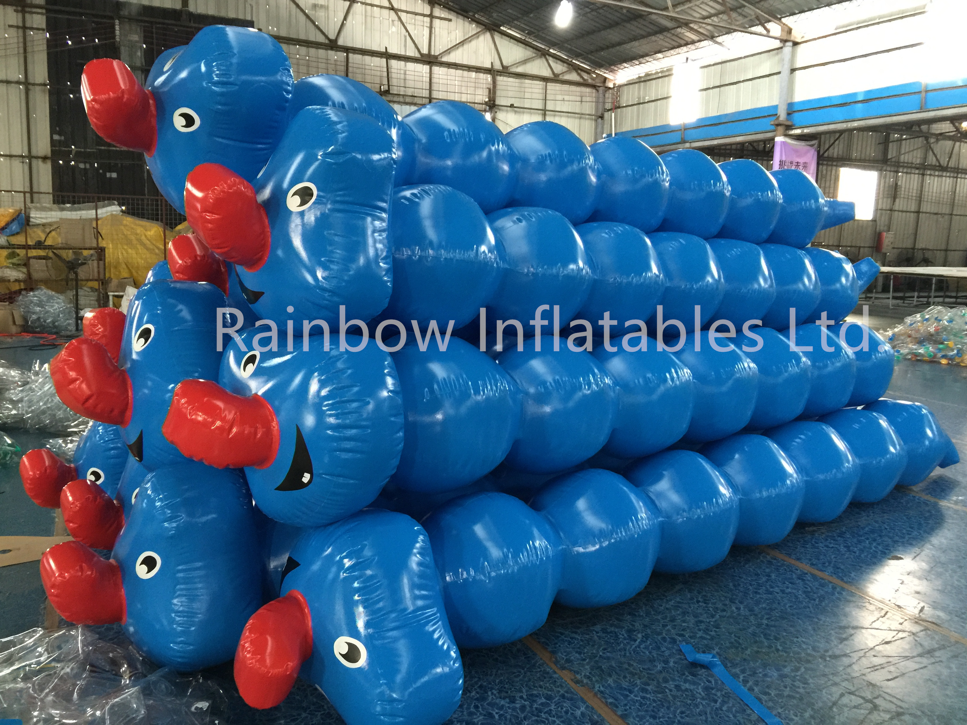 Team Building Inflatable Human Flip It Games-Rainbow Inflatables
