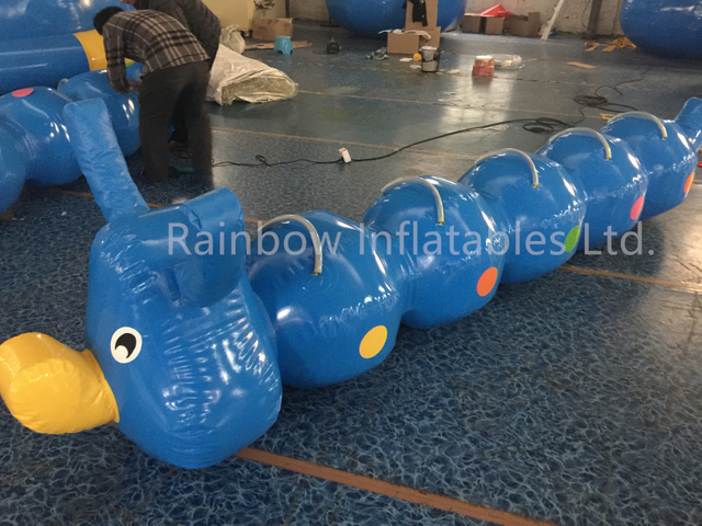Team Building Inflatable Human Flip It Games-Rainbow Inflatables