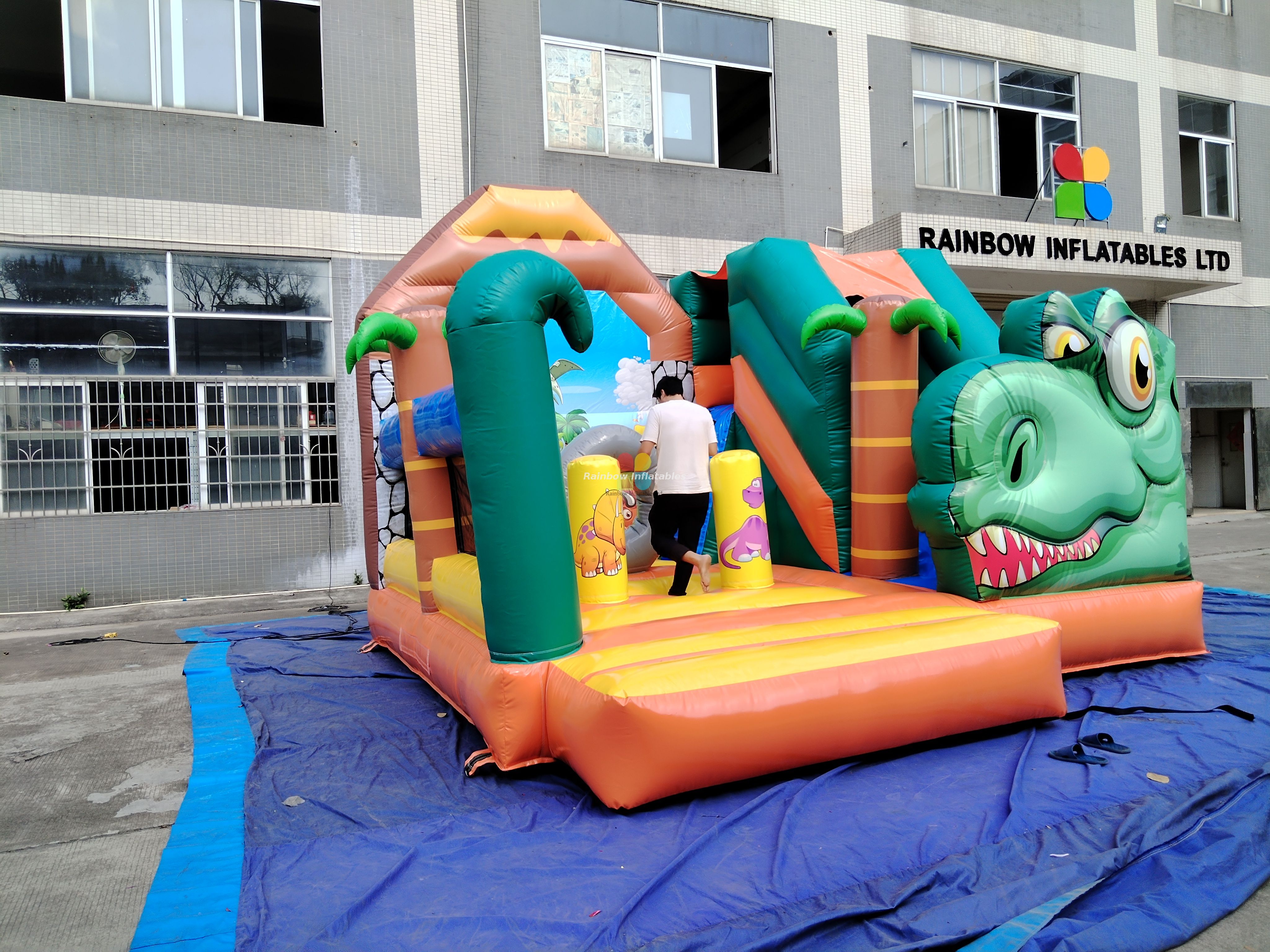 Rainbow Inflatable dinosaur bounce house with slide 