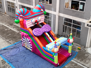 Giant Circus Theme Inflatable Slide with Clown Face Design, Rainbow Colors, and Tunnel Entrance